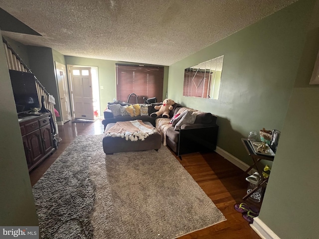 2818 Hellerman St, Philadelphia, PA 19149 - living room with stairs, a textured ceiling, dark wood finished floors, and baseboards