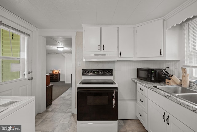 kitchen with white cabinets, plenty of natural light, under cabinet range hood, range with electric stovetop, and black microwave