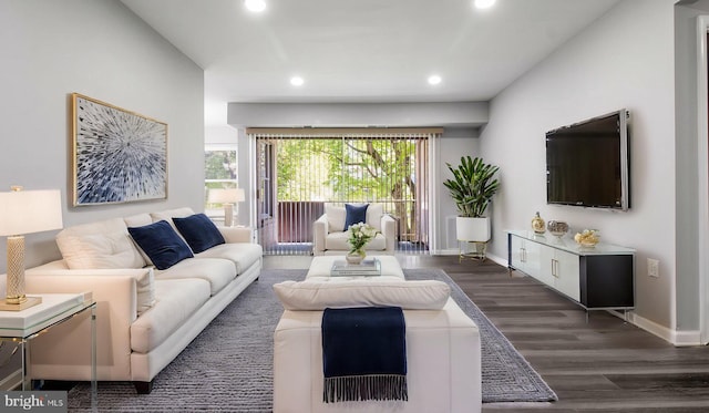 living room with baseboards, recessed lighting, and dark wood-type flooring