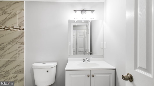 full bath with vanity and toilet