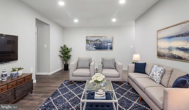 living room featuring recessed lighting, baseboards, and wood finished floors