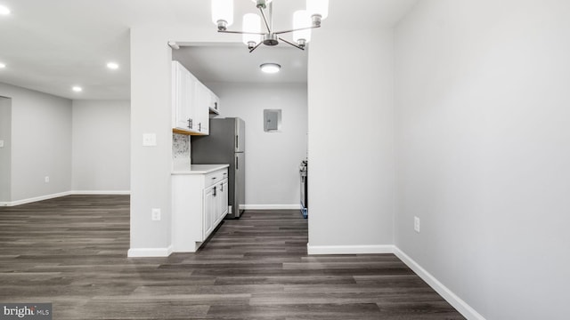 kitchen featuring white cabinets, a notable chandelier, light countertops, freestanding refrigerator, and recessed lighting