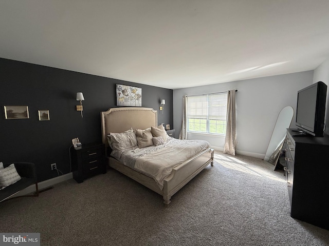 carpeted bedroom with baseboards