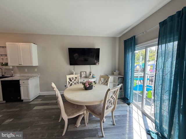 dining room with baseboards and dark wood-style floors