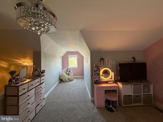 carpeted bedroom featuring baseboards, vaulted ceiling, and an inviting chandelier
