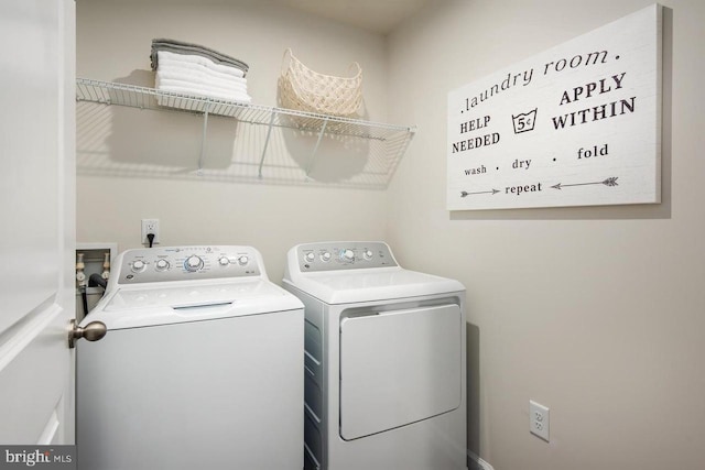 clothes washing area with laundry area and separate washer and dryer