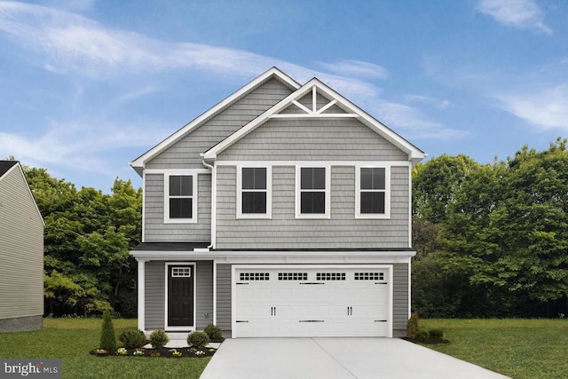 craftsman house featuring a garage, driveway, and a front lawn
