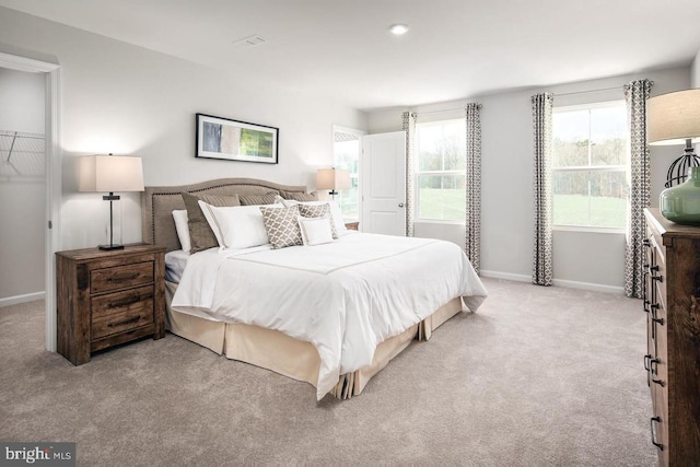 carpeted bedroom featuring baseboards