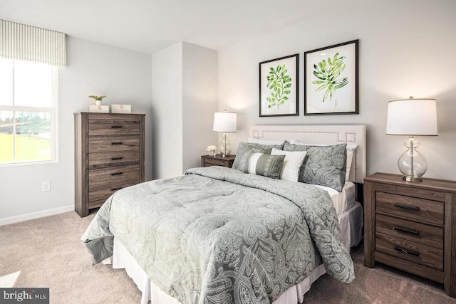 carpeted bedroom with baseboards