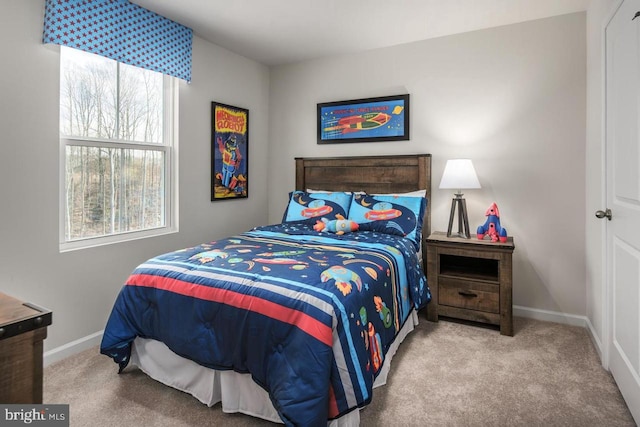 bedroom featuring baseboards and carpet flooring