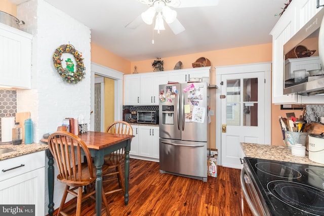 kitchen with white cabinets, ceiling fan, appliances with stainless steel finishes, and dark wood-style floors