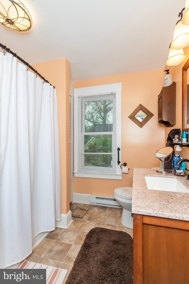 bathroom featuring baseboard heating, curtained shower, vanity, baseboards, and toilet