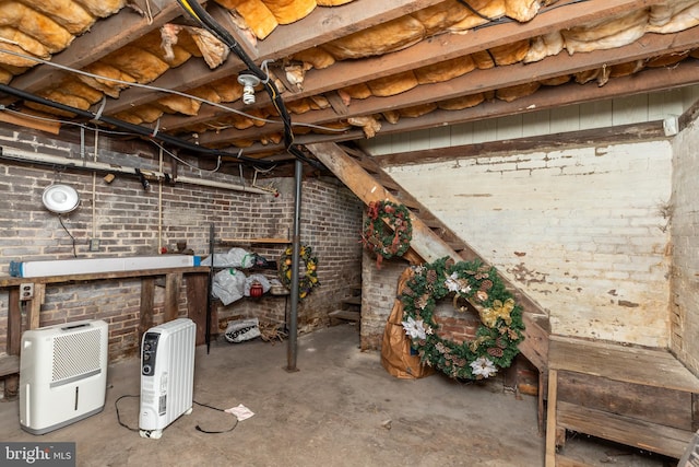 unfinished basement with brick wall