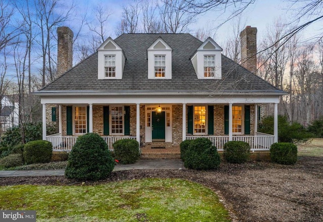 6008 Finchingfield Rd, Warrenton, VA 20187 - view of front of house with a chimney, a porch, and brick siding