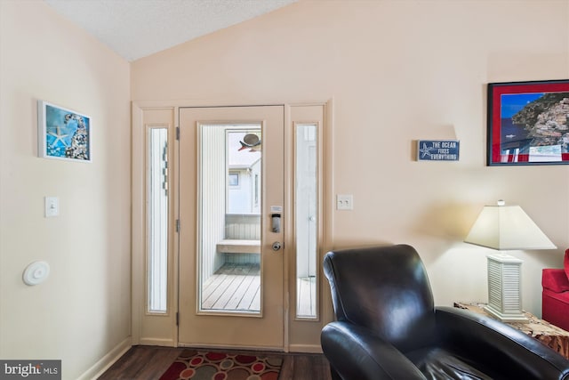 39234 Timberlake Ct Unit 9203, Bethany Beach, DE 19930 - doorway with lofted ceiling, dark wood-style flooring, and baseboards