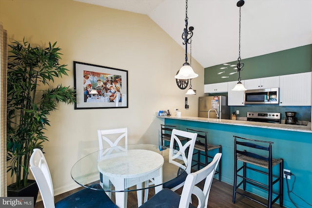 39234 Timberlake Ct Unit 9203, Bethany Beach, DE 19930 - dining area with high vaulted ceiling and dark wood finished floors