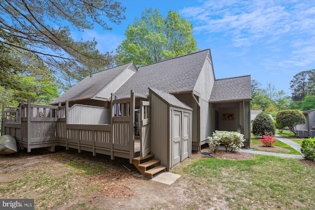 39234 Timberlake Ct Unit 9203, Bethany Beach, DE 19930 - view of home's exterior with roof with shingles, a deck, and central AC