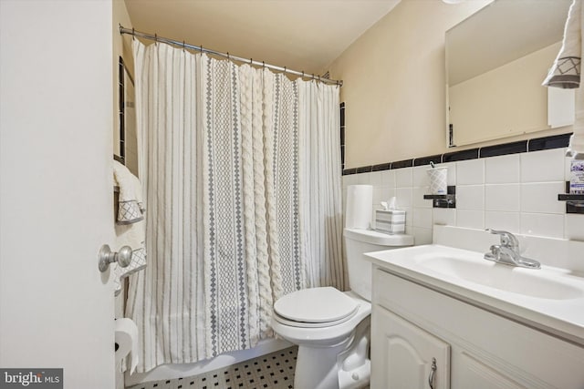 80 W Baltimore Ave Unit C507, Lansdowne, PA 19050 - full bathroom with vanity, tile walls, a shower with shower curtain, and wainscoting