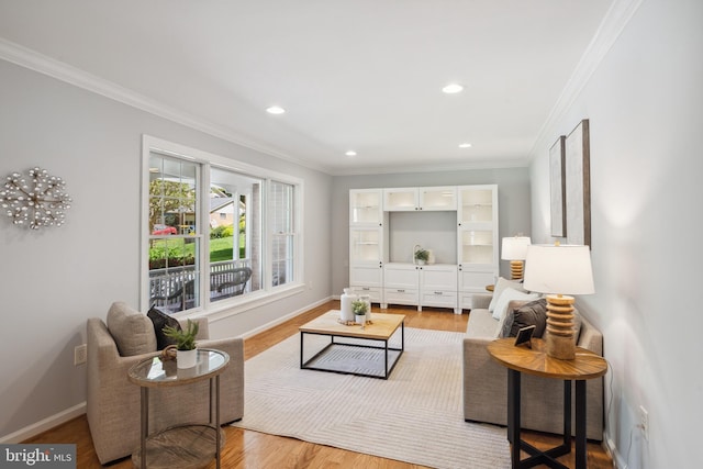 living room featuring crown molding, wood finished floors, baseboards, and recessed lighting