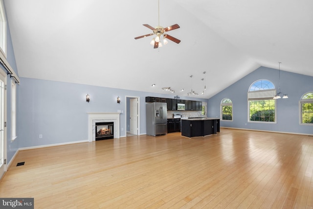 111 Fox Hill Rd, Front Royal, VA 22630 - unfurnished living room with a premium fireplace, a ceiling fan, healthy amount of natural light, light wood finished floors, and high vaulted ceiling