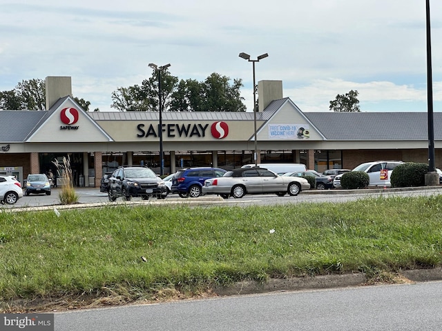 view of property with uncovered parking