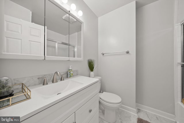 full bath with vanity, baseboards, toilet, and marble finish floor
