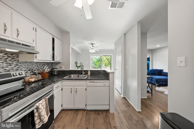 kitchen with white dishwasher, ceiling fan, a sink, electric stove, and visible vents