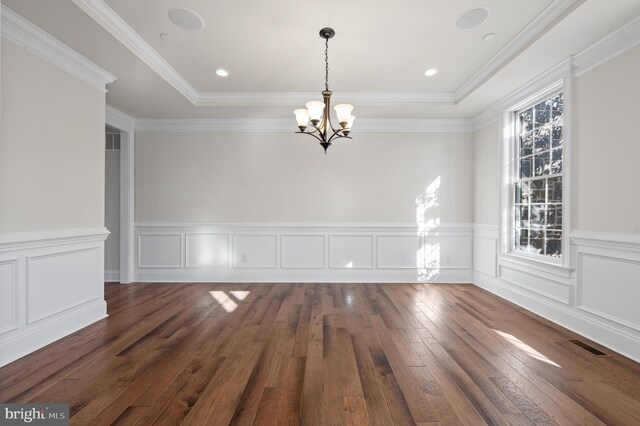 3703 Biddle Ln, Newtown Square, PA 19073 - unfurnished dining area featuring an inviting chandelier, a raised ceiling, a wainscoted wall, and hardwood / wood-style flooring