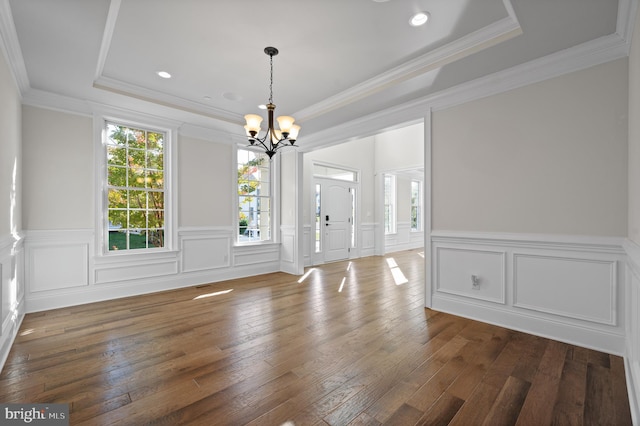 3703 Biddle Ln, Newtown Square, PA 19073 - unfurnished dining area with a chandelier, a wainscoted wall, a raised ceiling, and hardwood / wood-style floors