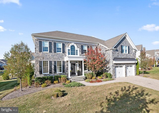 3703 Biddle Ln, Newtown Square, PA 19073 - georgian-style home featuring an attached garage, driveway, a front lawn, and stone siding