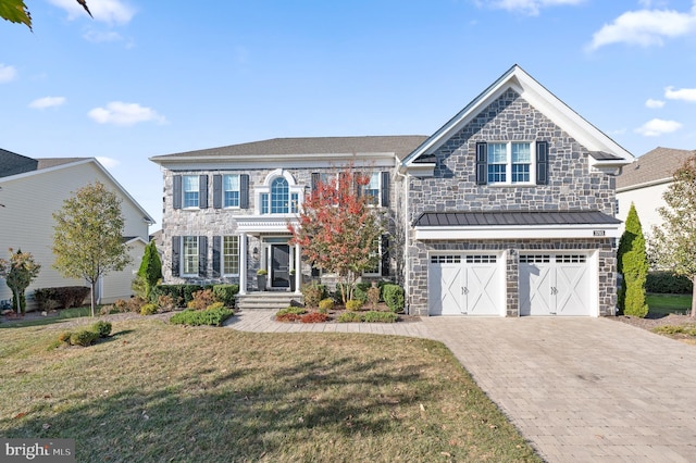 3703 Biddle Ln, Newtown Square, PA 19073 - view of front facade featuring decorative driveway, an attached garage, stone siding, and a front lawn