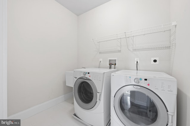 3703 Biddle Ln, Newtown Square, PA 19073 - clothes washing area with baseboards, laundry area, light tile patterned flooring, and independent washer and dryer