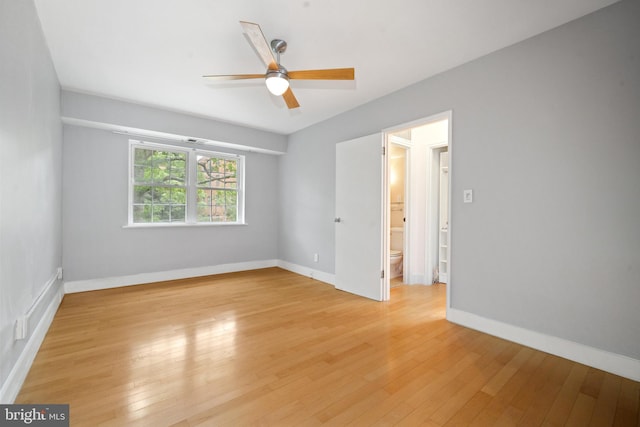 1301 N Ode St Unit 135, Arlington, VA 22209 - empty room featuring a ceiling fan, light wood-style floors, and baseboards