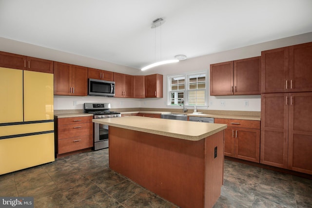 1417 Franklin St, Fredericksburg, VA 22401 - kitchen with appliances with stainless steel finishes, light countertops, a kitchen island, stone finish flooring, and a sink