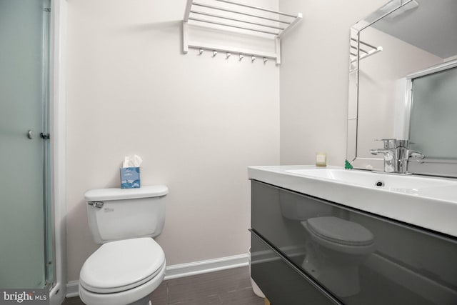 1417 Franklin St, Fredericksburg, VA 22401 - bathroom featuring toilet, baseboards, and vanity