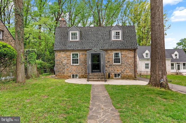 6248 Woodcrest Ave, Baltimore, MD 21209 - view of front of home featuring entry steps, a front yard, and stone siding