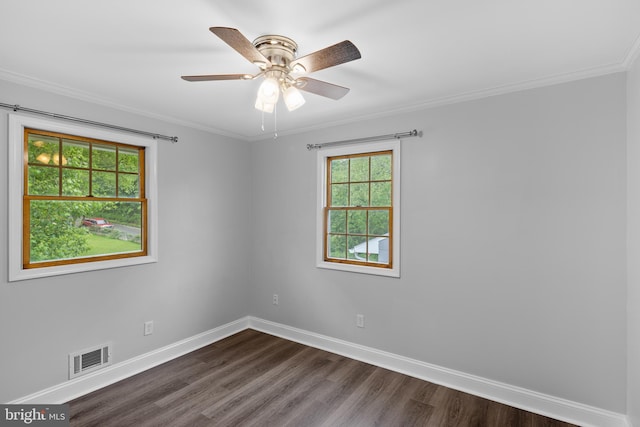 310 18th Ave, Baltimore, MD 21225 - spare room with baseboards, dark wood-style flooring, ceiling fan, visible vents, and crown molding