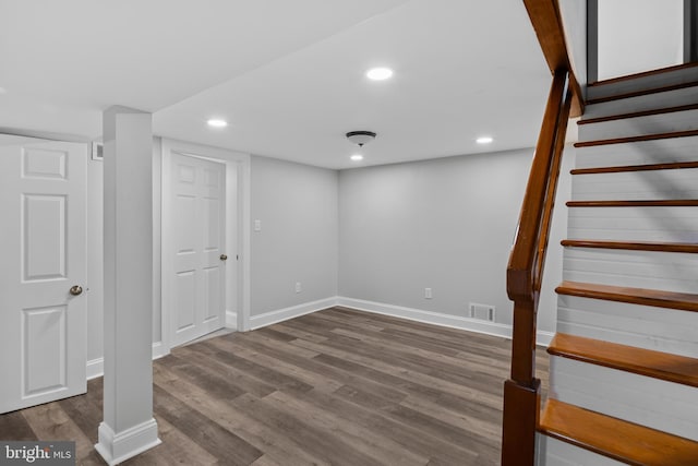 310 18th Ave, Baltimore, MD 21225 - finished below grade area featuring wood finished floors, stairs, visible vents, baseboards, and recessed lighting