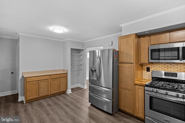 310 18th Ave, Baltimore, MD 21225 - kitchen with stainless steel appliances, ornamental molding, dark wood finished floors, light countertops, and baseboards
