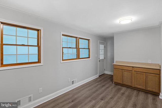 310 18th Ave, Baltimore, MD 21225 - interior space featuring crown molding, dark wood finished floors, visible vents, and baseboards