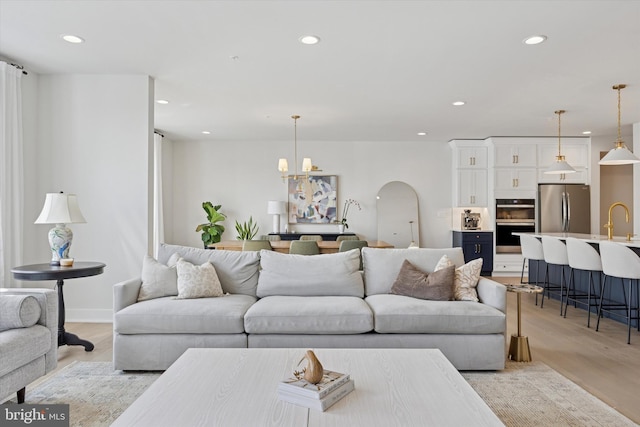 9 Mill Creek Dr, Doylestown, PA 18901 - living area with light wood-style floors, recessed lighting, and arched walkways