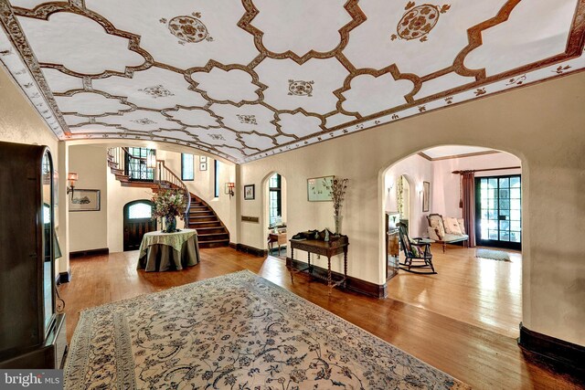 218 Parkside Ave, Trenton, NJ 08618 - entrance foyer with arched walkways, hardwood / wood-style flooring, baseboards, stairway, and ornamental molding