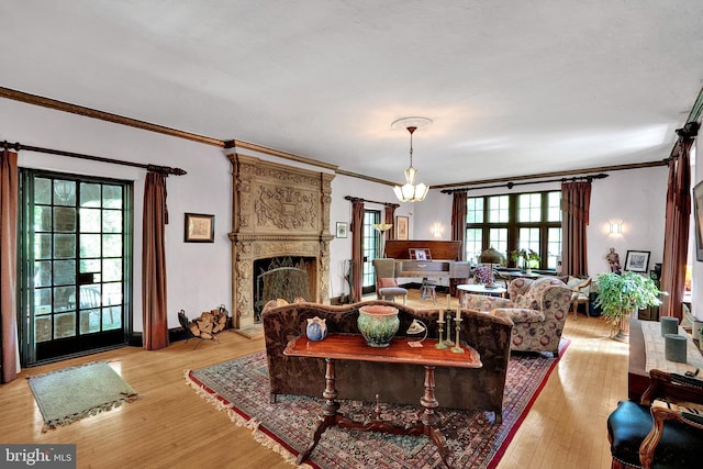 218 Parkside Ave, Trenton, NJ 08618 - living room featuring light wood finished floors, ornamental molding, a high end fireplace, and a chandelier