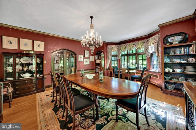 218 Parkside Ave, Trenton, NJ 08618 - dining room with a chandelier, light wood finished floors, and ornamental molding