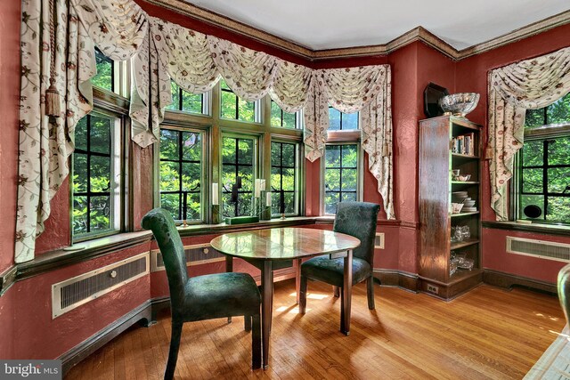218 Parkside Ave, Trenton, NJ 08618 - dining room with wood finished floors, crown molding, baseboards, and plenty of natural light