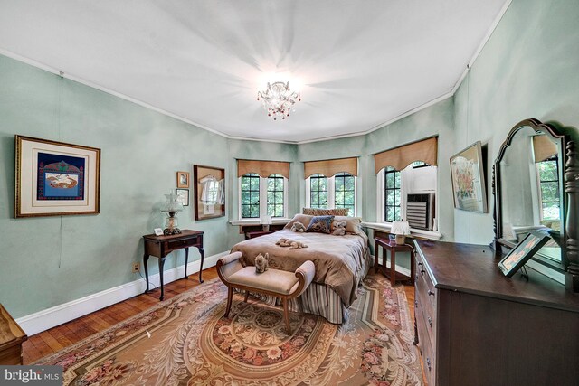 218 Parkside Ave, Trenton, NJ 08618 - bedroom with a chandelier, wood finished floors, baseboards, and crown molding