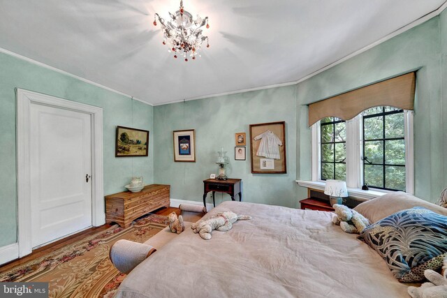 218 Parkside Ave, Trenton, NJ 08618 - bedroom with wood finished floors, crown molding, a chandelier, and baseboards