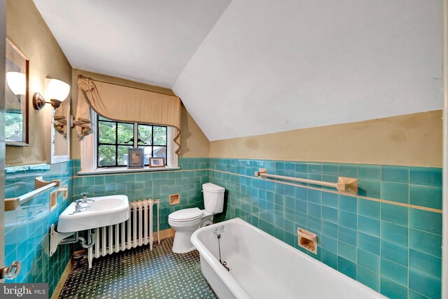 218 Parkside Ave, Trenton, NJ 08618 - full bath with a bathtub, toilet, tile walls, lofted ceiling, and a wainscoted wall