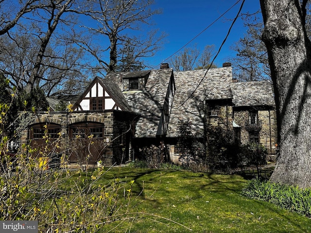 218 Parkside Ave, Trenton, NJ 08618 - view of front of home featuring a chimney, a front lawn, a high end roof, and stone siding