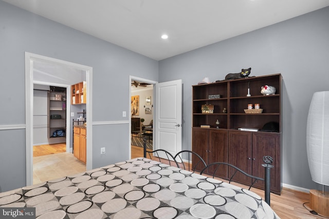 bedroom with light wood-type flooring and recessed lighting
